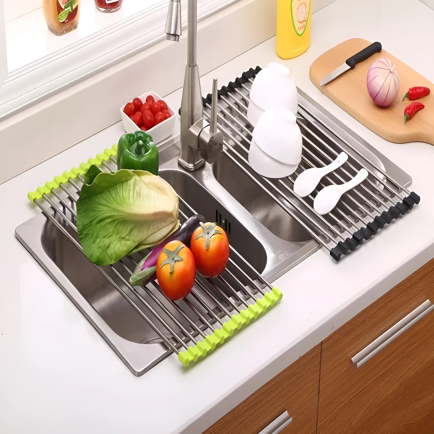 Folding stainless steel kitchen sink drying rack in red colour, shown extended for use.