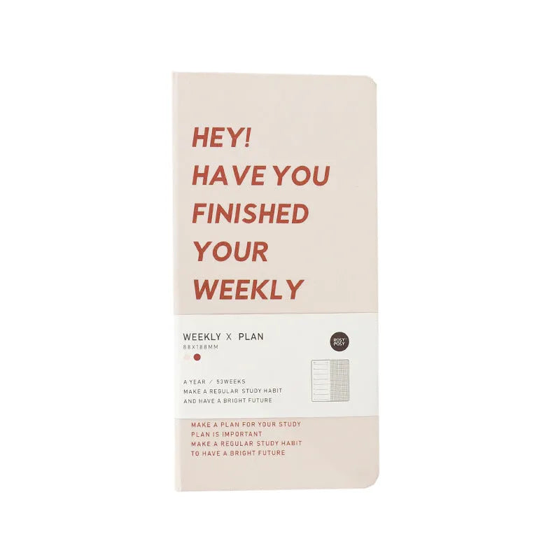 A5 weekly plan diary handbook open on a desk, showing weekly layout, with blue, brown, green, and purple cover options.