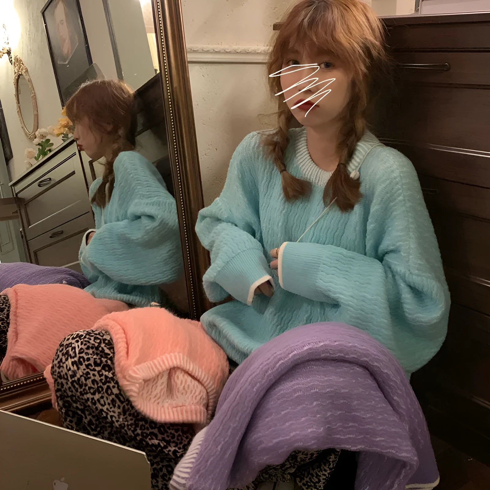 A lake blue women's loose-fitting retro-style pullover sweater with regular sleeves.