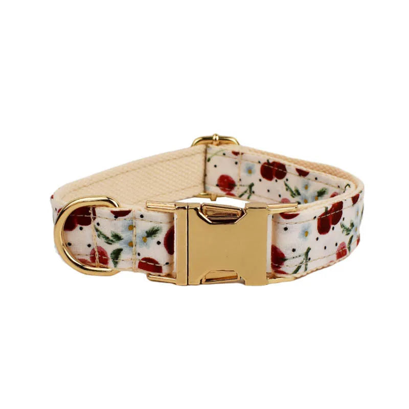Red cherry printed dog collar and leash set with light gold buckle and decorative bow strap