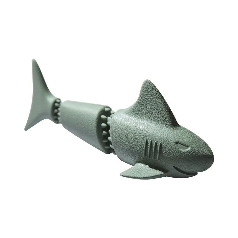 Blue and green shark-shaped rubber dog chew toy on a white background.