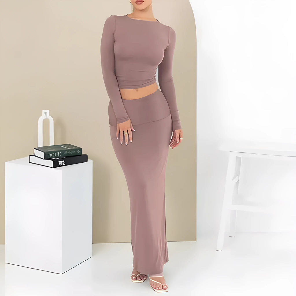 Women's sweet style polyester two-piece suit with three-quarter sleeve top and long skirt.