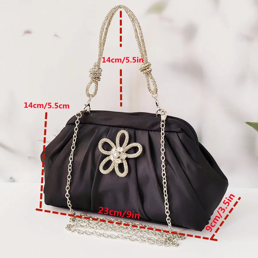 Soft black polyester women's shoulder messenger bag showing chain detail and fold styling.