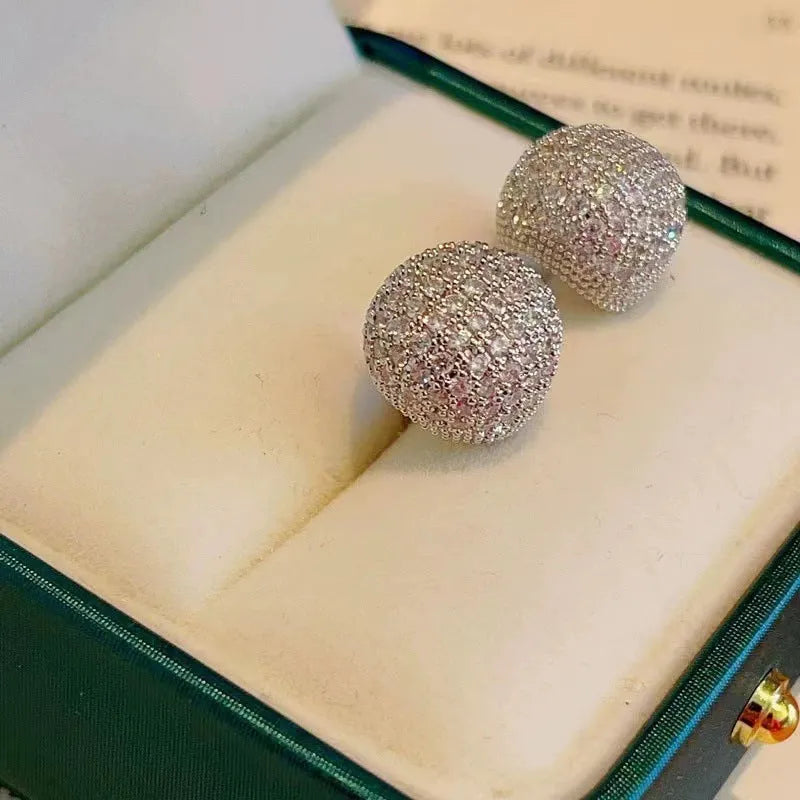 Golden bean earrings with diamond-cut detailing and ear clip fastening in drop shape