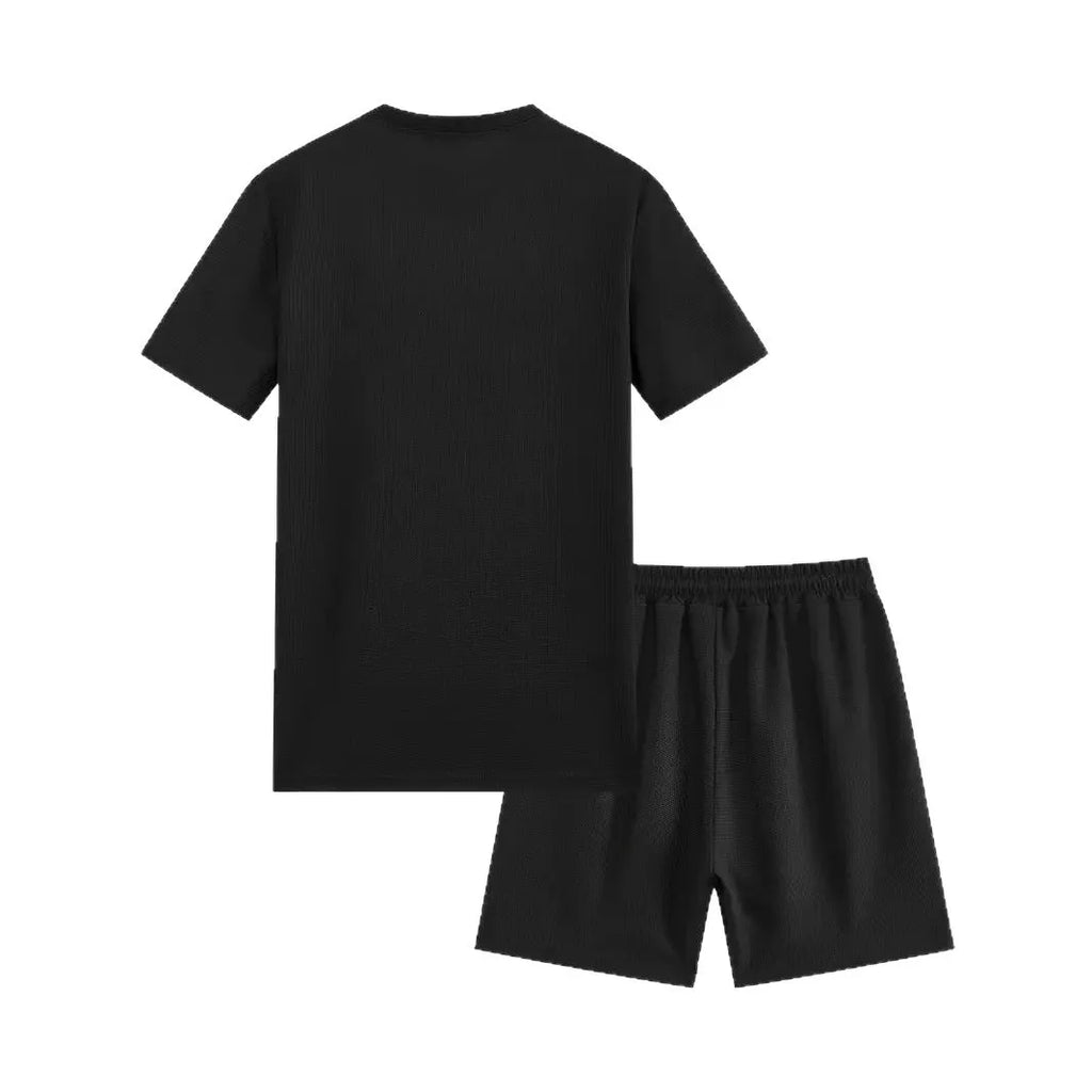Man wearing a light waffle-texture short sleeve blouse and matching shorts in apricot colour.