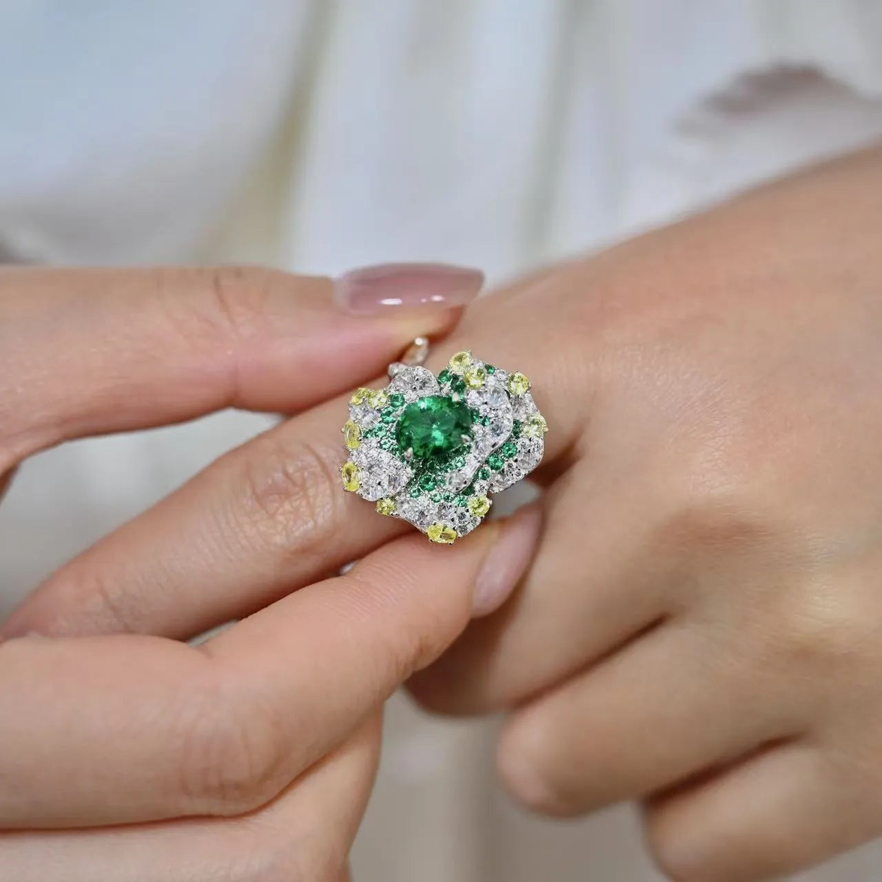 Secret Garden Series gradient emerald ring on a plain background showing the stone colour