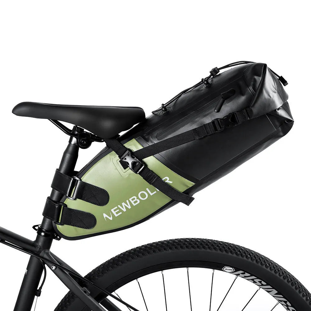 Black waterproof PVC bicycle tail bag mounted on a bike rack.