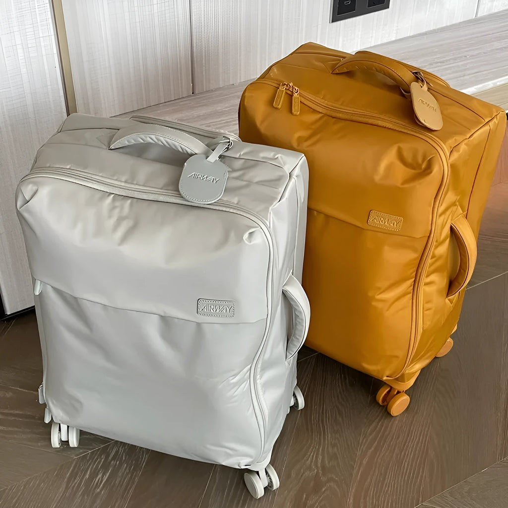 Waterproof Oxford cloth suitcase with universal wheels in six colour options including tea brown and haze blue