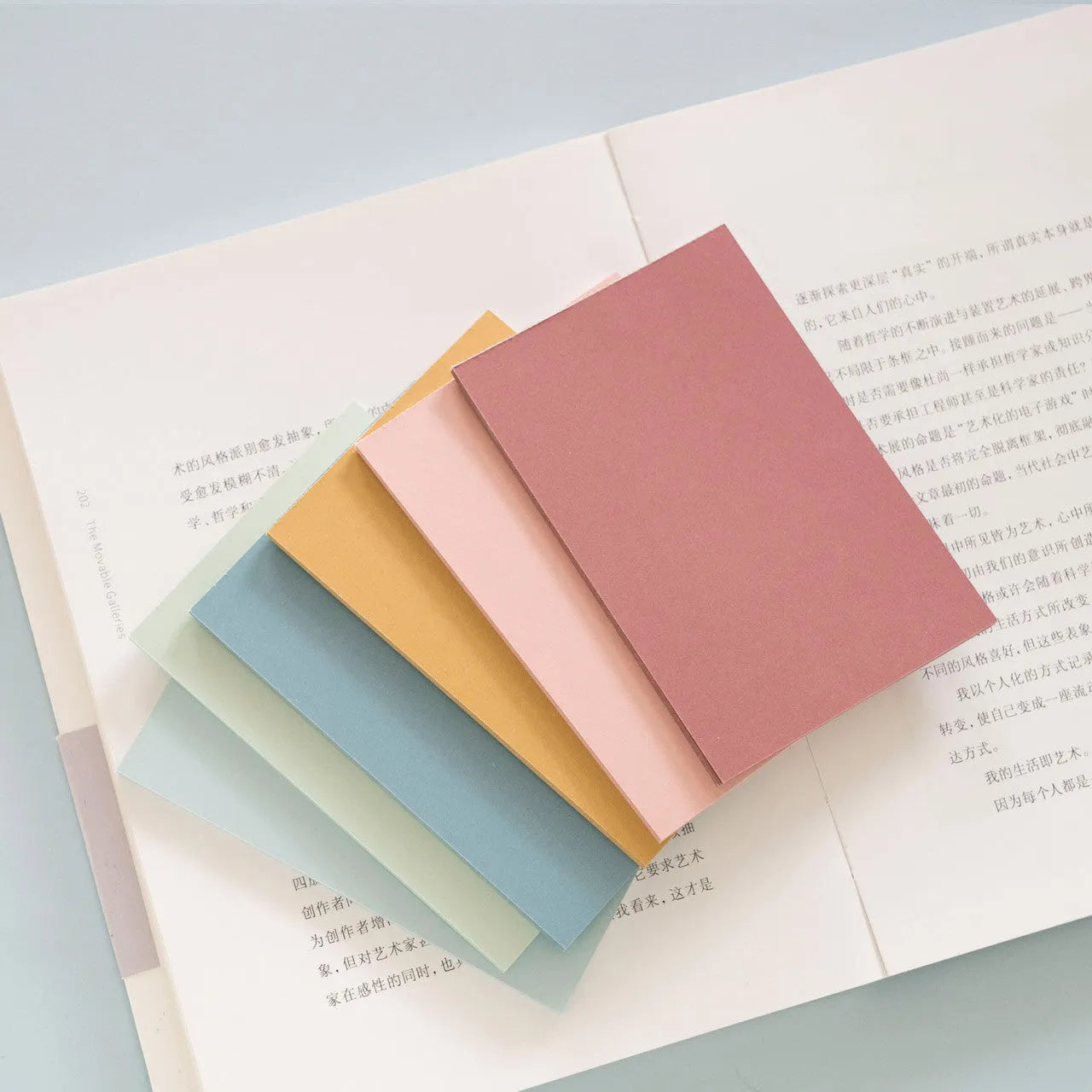 Large self-adhesive sticky notes in six colours measuring 12cm by 8cm, pack of 150 sheets for organisation