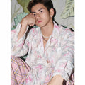 Pink and blue long sleeve shirt with a raised embossed floral pattern, shown in a loose fit.