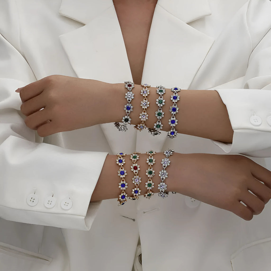 Coloured gemstone bracelet with flower-shaped design in gold and silver colour variations