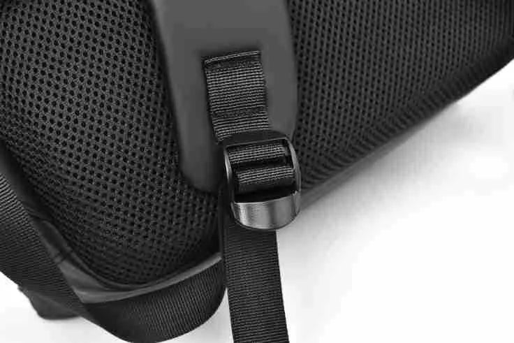 Large waterproof backpack in black, blue, or grey with PU leather construction and computer compartment