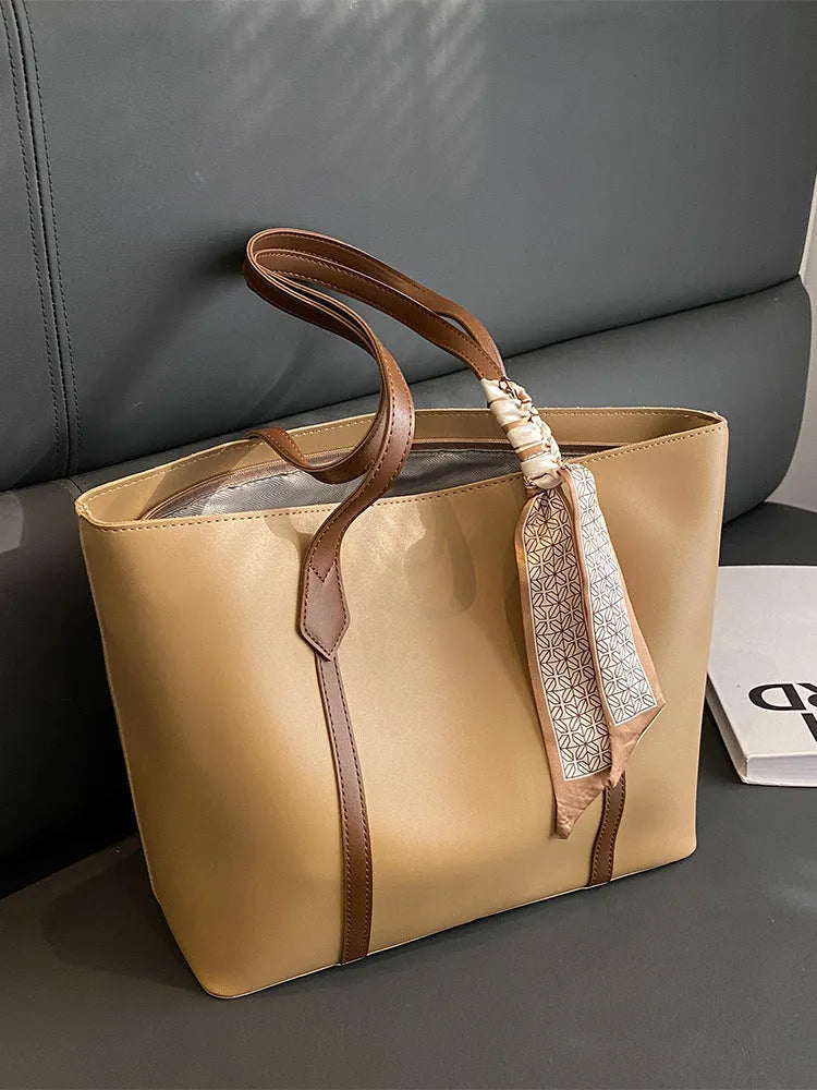 Soft large capacity tote bag with crossbody strap showing internal zipper compartment