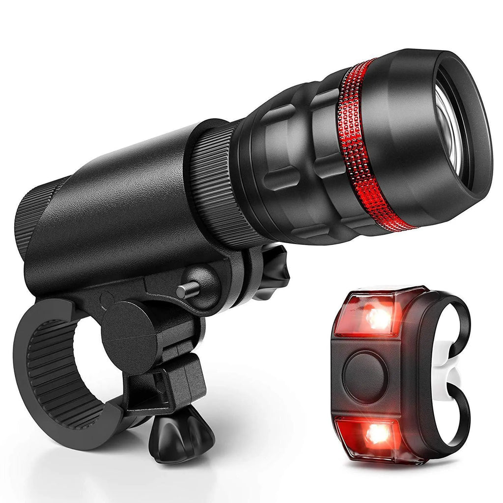 Bicycle safety set showing a front flashlight, a rear taillight, and a black mounting bracket on a white background.