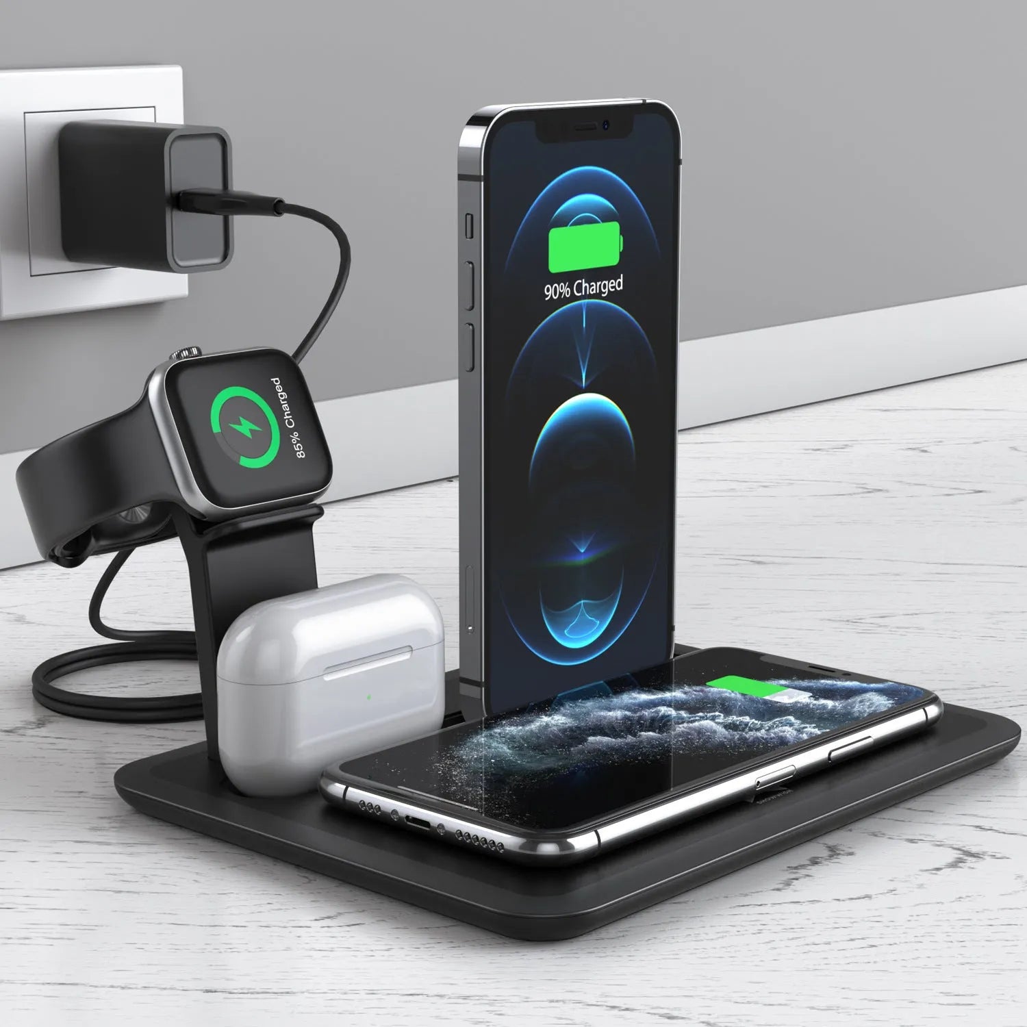 Black and white desktop wireless charging station for phone, headphones, and smartwatch with USB cable.