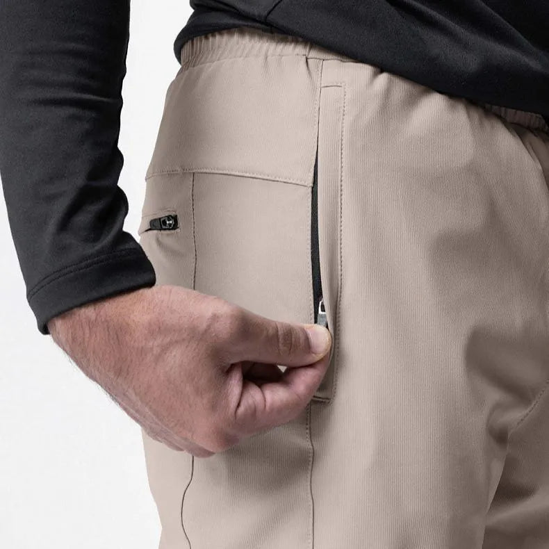Men's loose grey ankle-tied fitness pants with a casual cut for running and gym workouts.