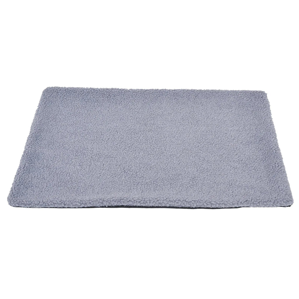 Grey self-heating plush pet pad for cats and dogs on a wooden floor
