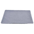 Grey self-heating plush pet pad for cats and dogs on a wooden floor