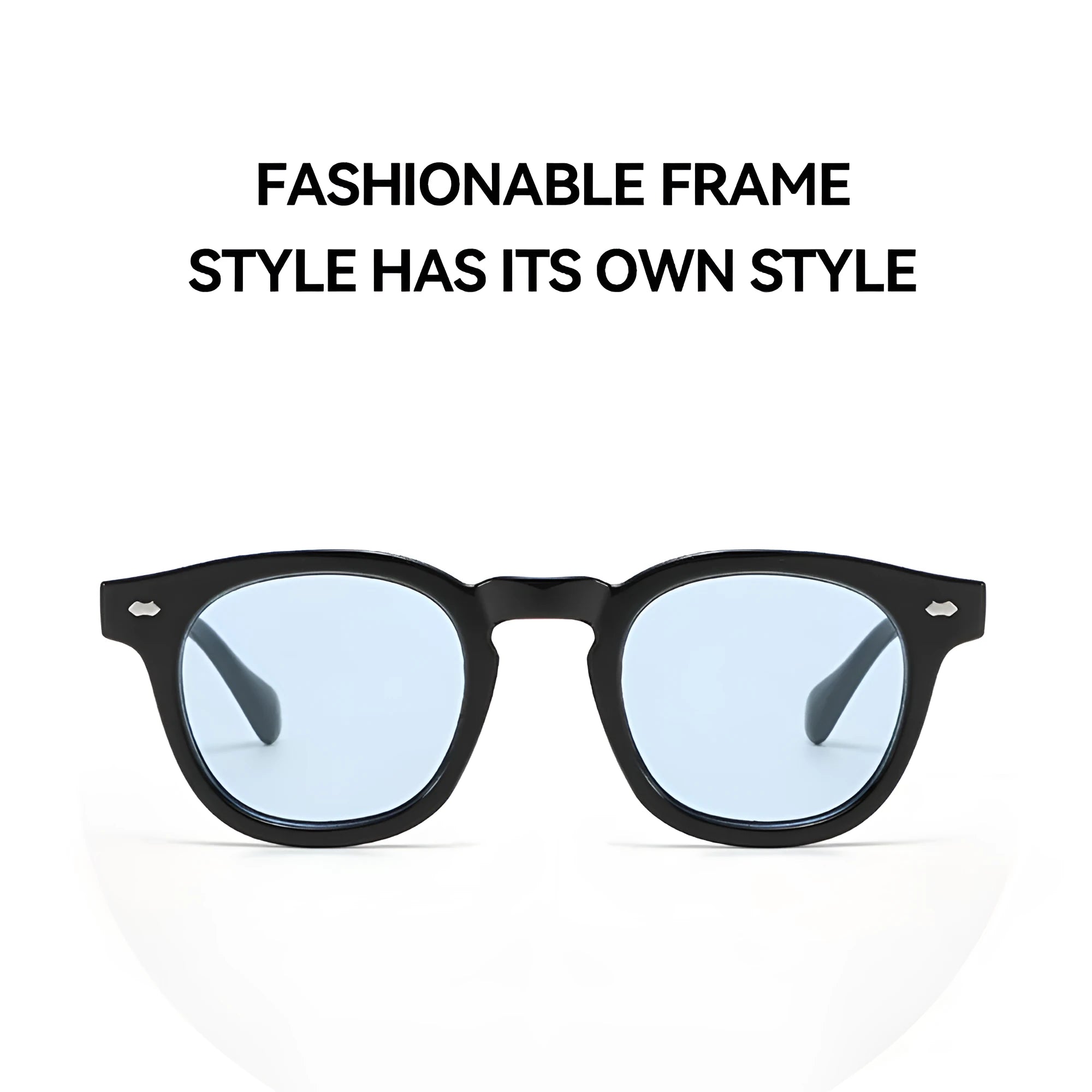 Round retro plastic sunglasses on a table, showing bright black frame with grey lens.