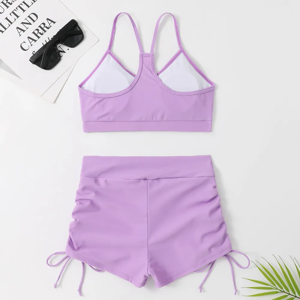 Women's high waist split swimsuit bikini set in purple or black, made from nylon and spandex.