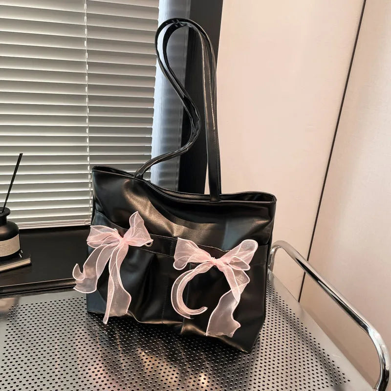 College style bow tote bag with double straps and zippered internal compartment in black colour