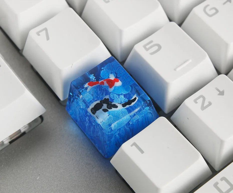 Handcrafted resin keycap with koi fish and pond scenery for Cherry MX keyboard switches.