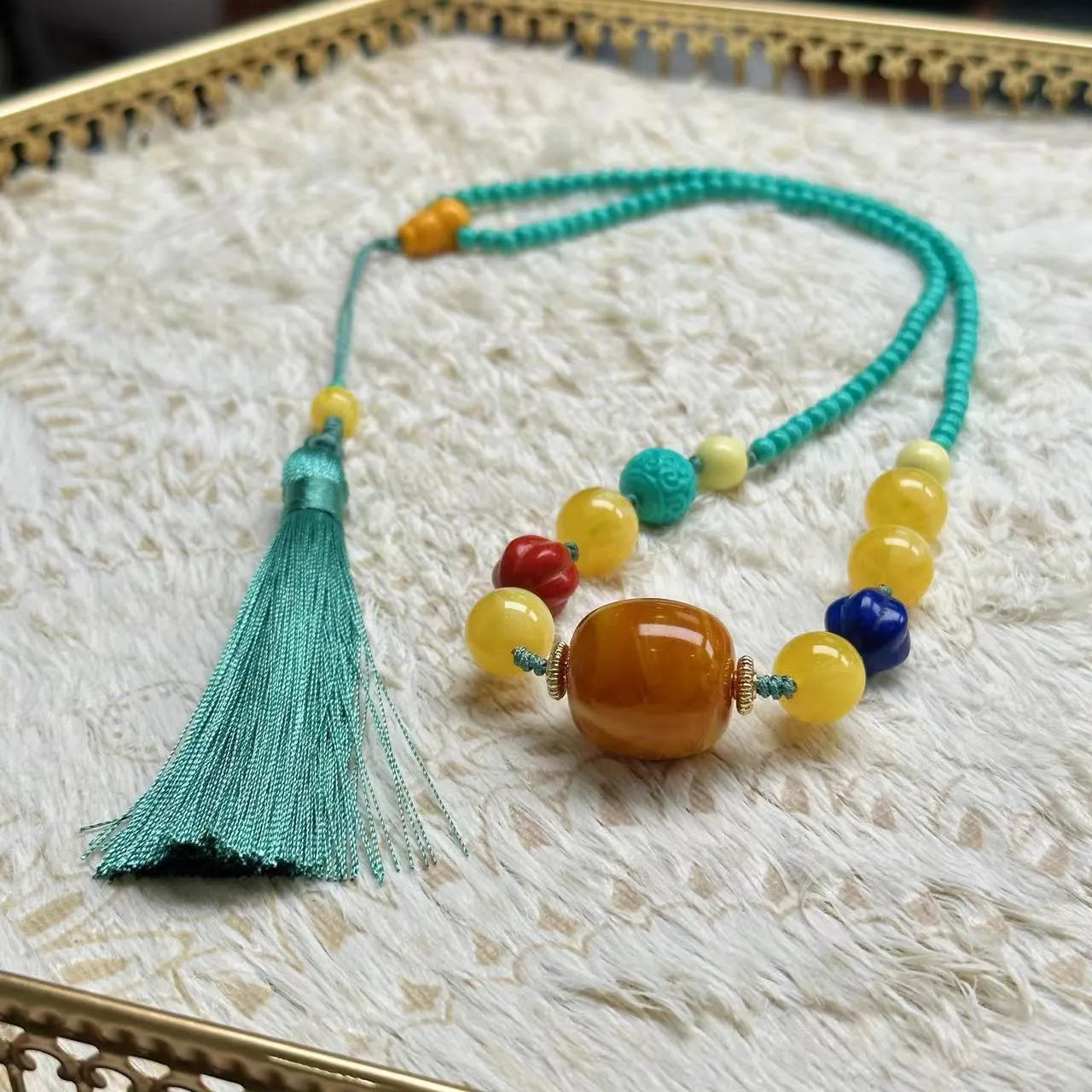 Hand-woven turquoise necklace with a large mesh flower lucky pendant on an adjustable ball bead chain.