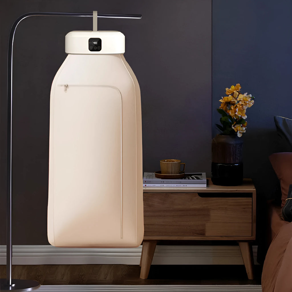 White cylindrical compact clothes dryer with remote control for dormitory use