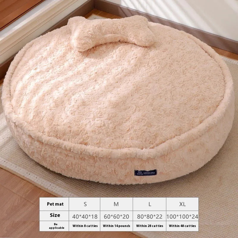 Round nest-style pet bed with a removable washable cover in a milk tea colour.