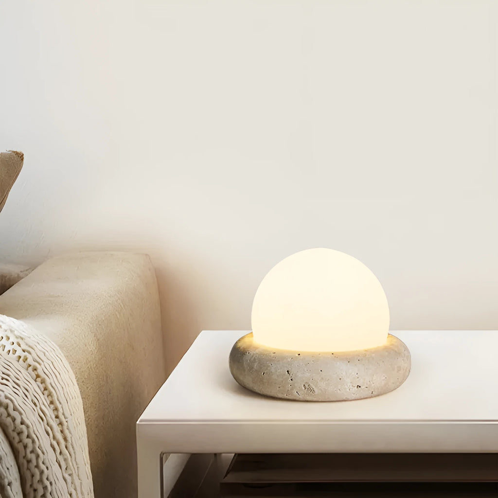 Cream coloured remote control bedside night light with circular 15.5cm diameter design