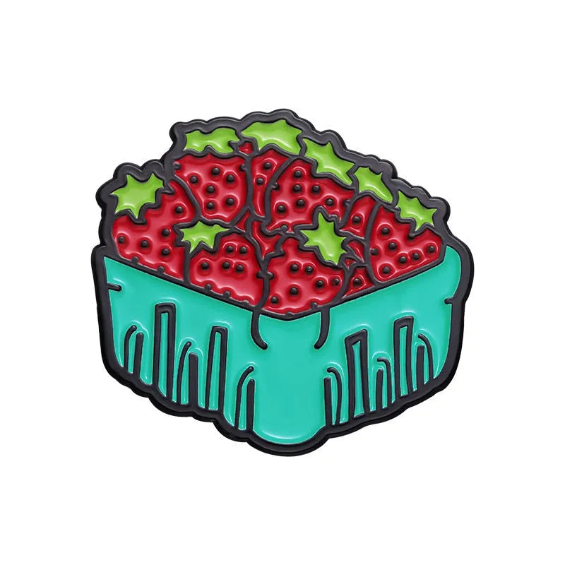 Colourful cartoon fruit and letter design on a metal brooch pin with a secure clasp.