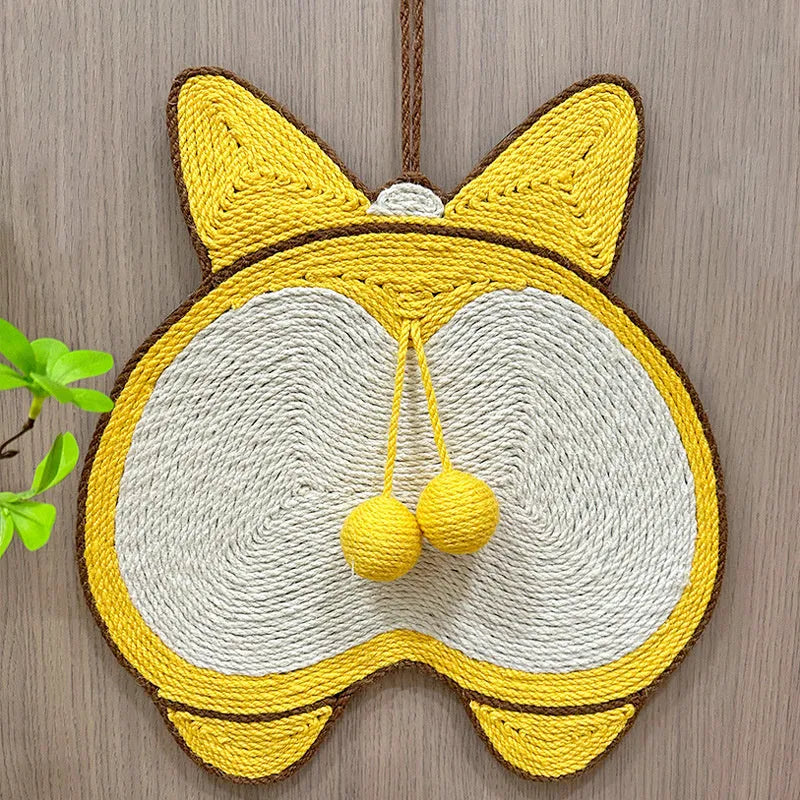 Yellow Corgi butt design sisal cat scratching pad with anti-slip base on a wooden floor.