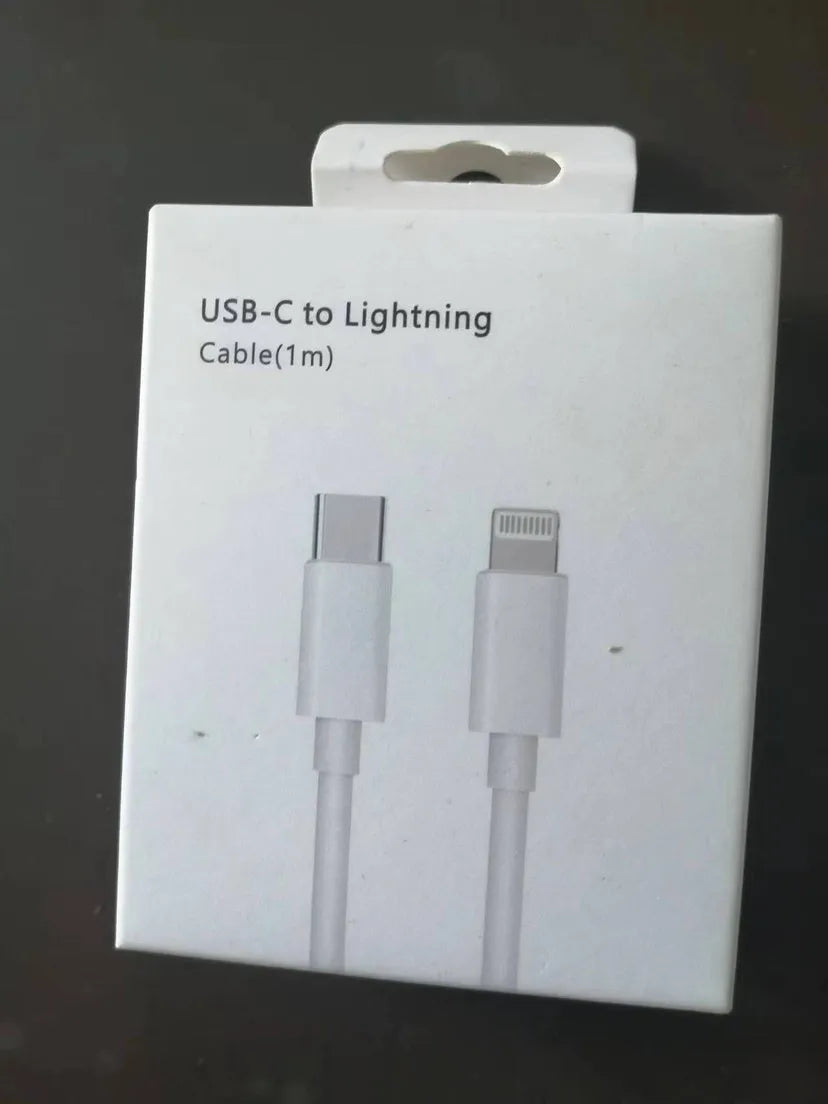 White 20W USB-C Power Delivery fast charger with British plug and coiled USB-C cable.