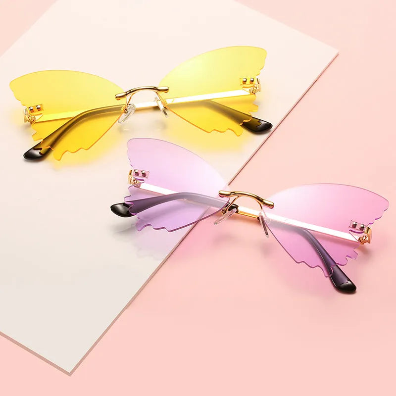 Butterfly rimless sunglasses with UV400 protection, vintage style, plastic and metal frame, available in blue green grey pink purple red yellow
