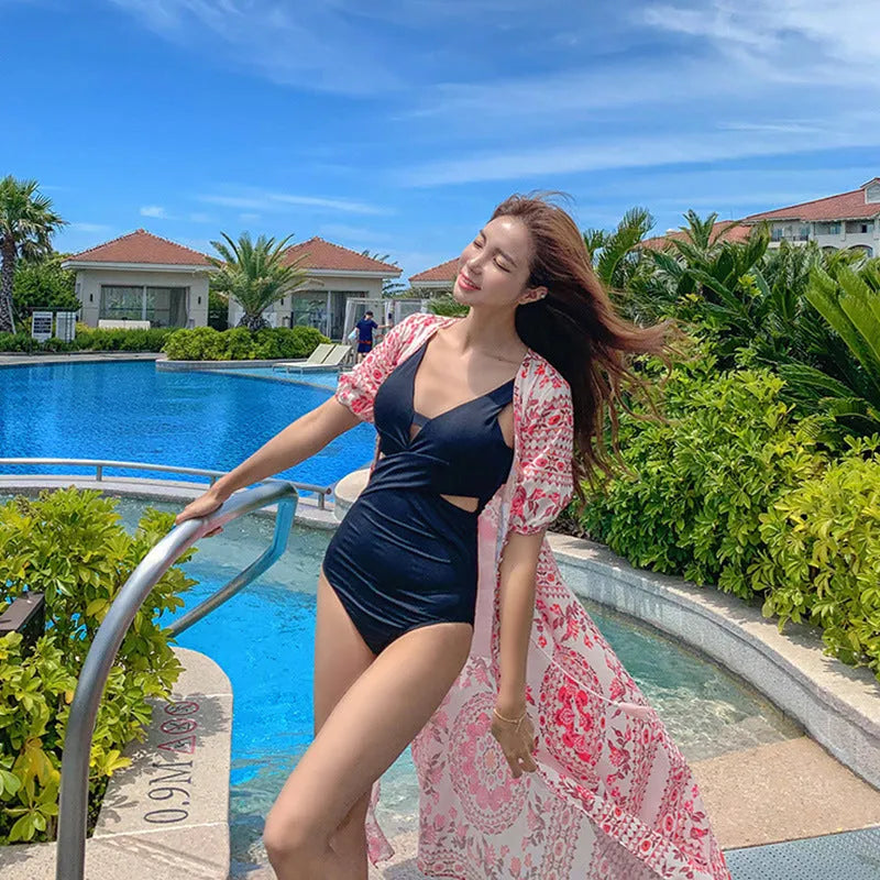 Women's dark blue hollow back Siamese style one-piece swimsuit made from polyester fabric
