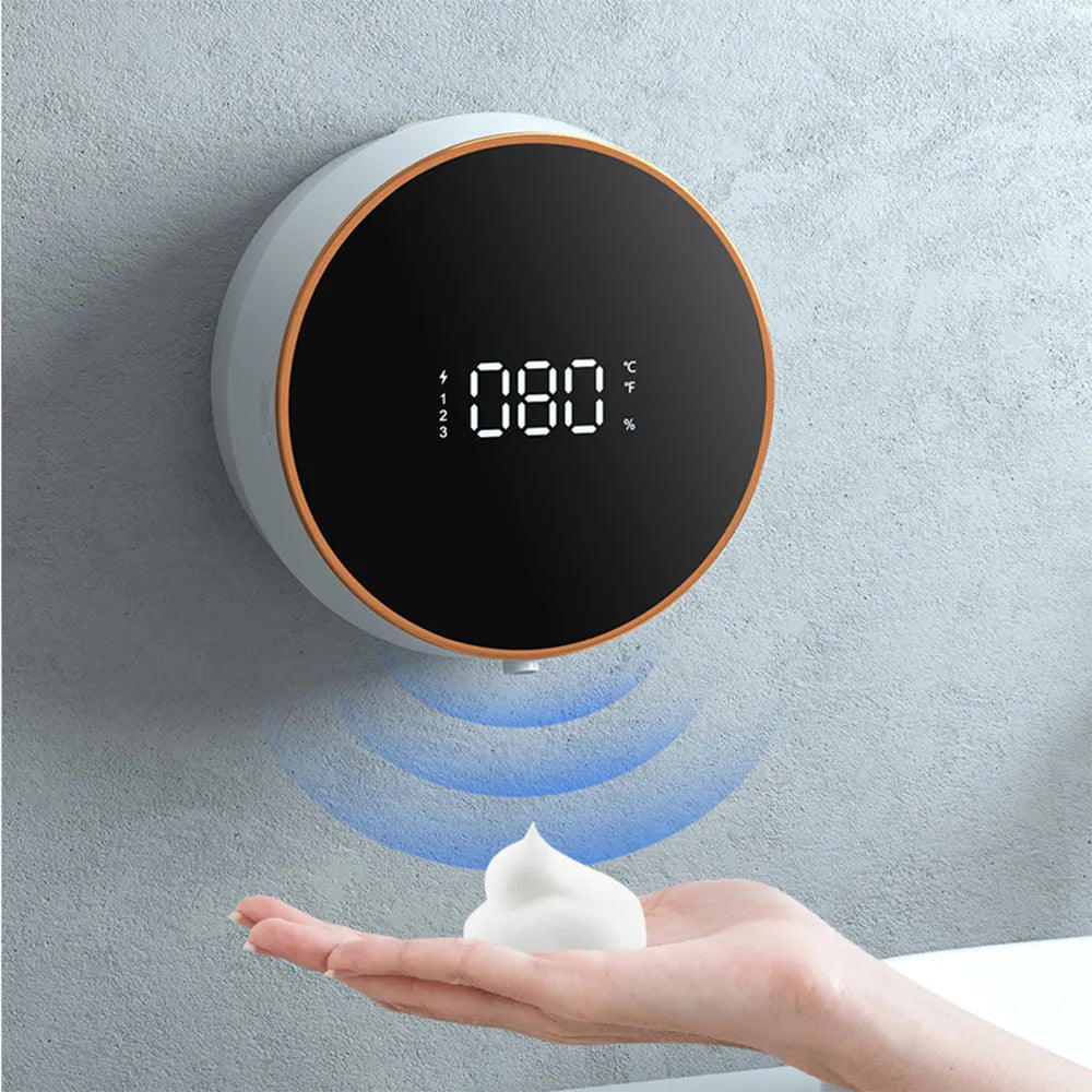Black automatic sensing foam dispenser with USB port mounted on bathroom wall