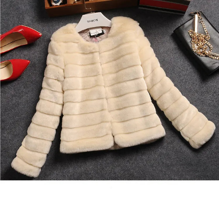 Women's short white faux fur top with regular sleeves on a hanger.