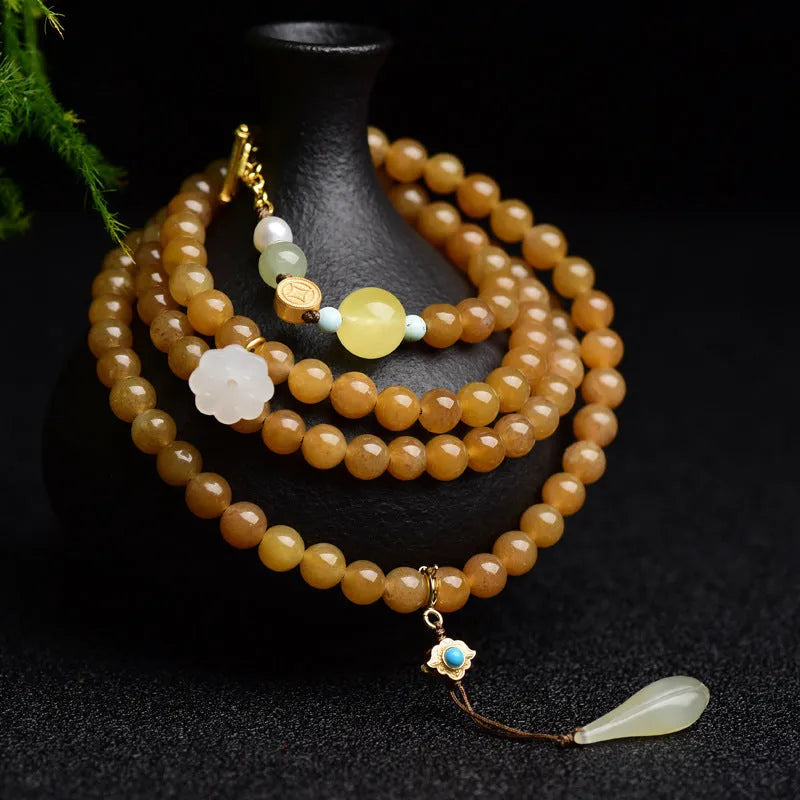 Jade beaded bracelet with green pine 6mm round beads, leaf charms, and beeswax accents