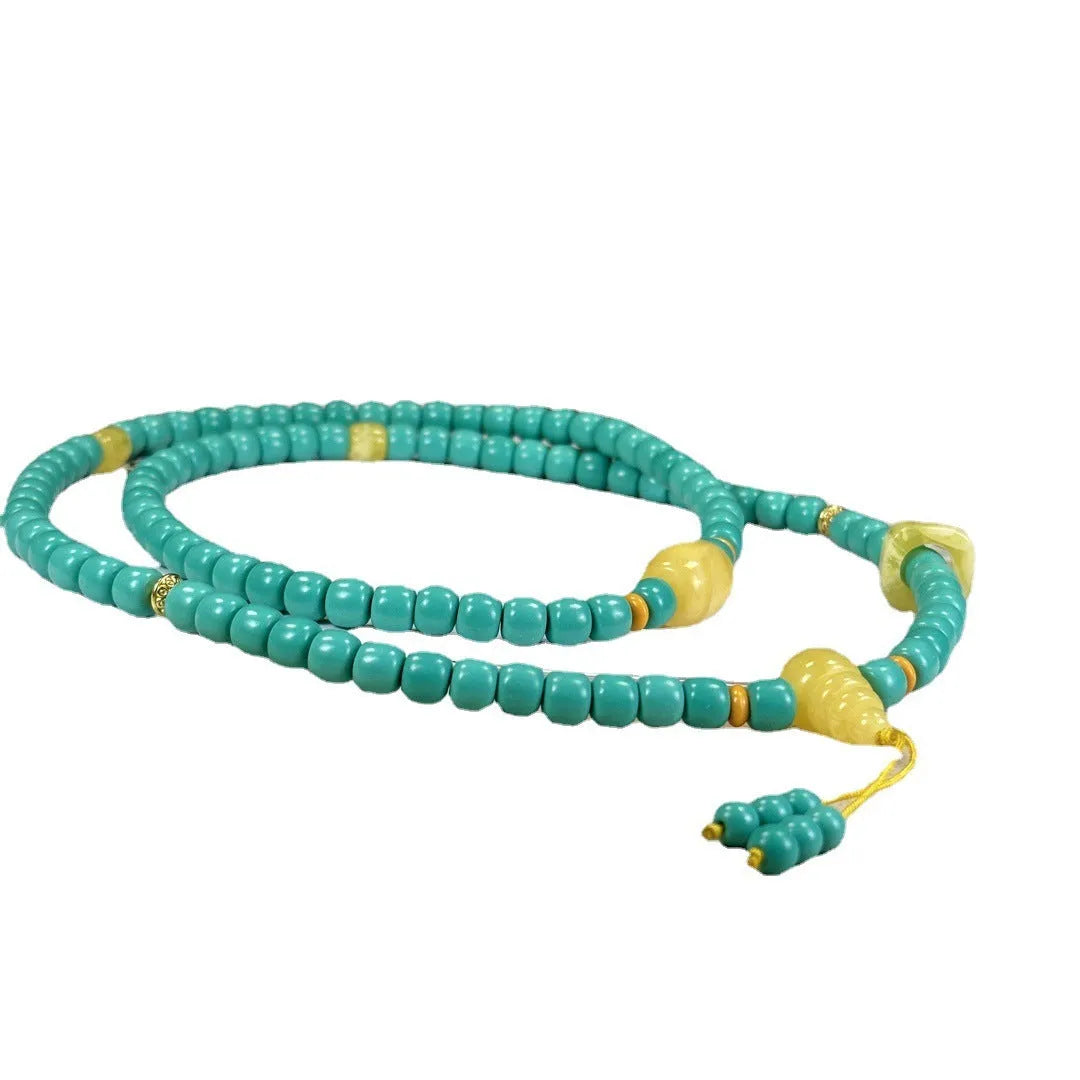 Hand-woven turquoise necklace with a large mesh flower lucky pendant on an adjustable ball bead chain.