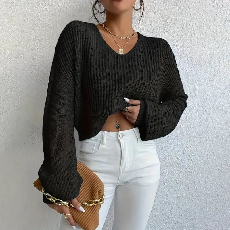 Women's solid colour long sleeve polyester pullover in a loose casual fit.