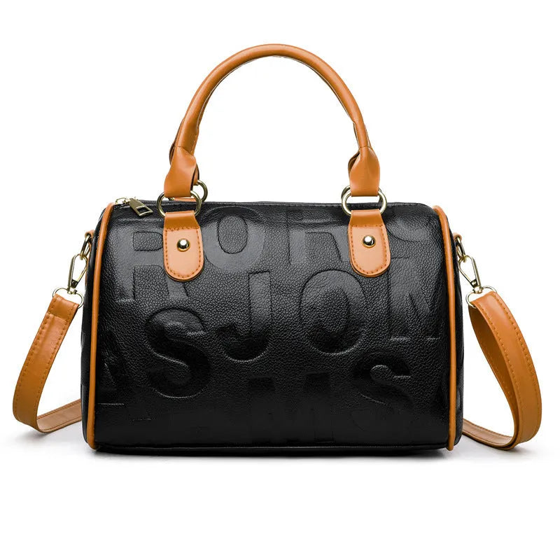 Brown cylindrical crossbody bag with leather-like texture and three shoulder straps