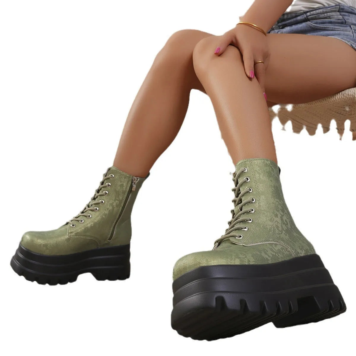 White women's platform boots with patchwork design, chunky block heel, and side zipper.