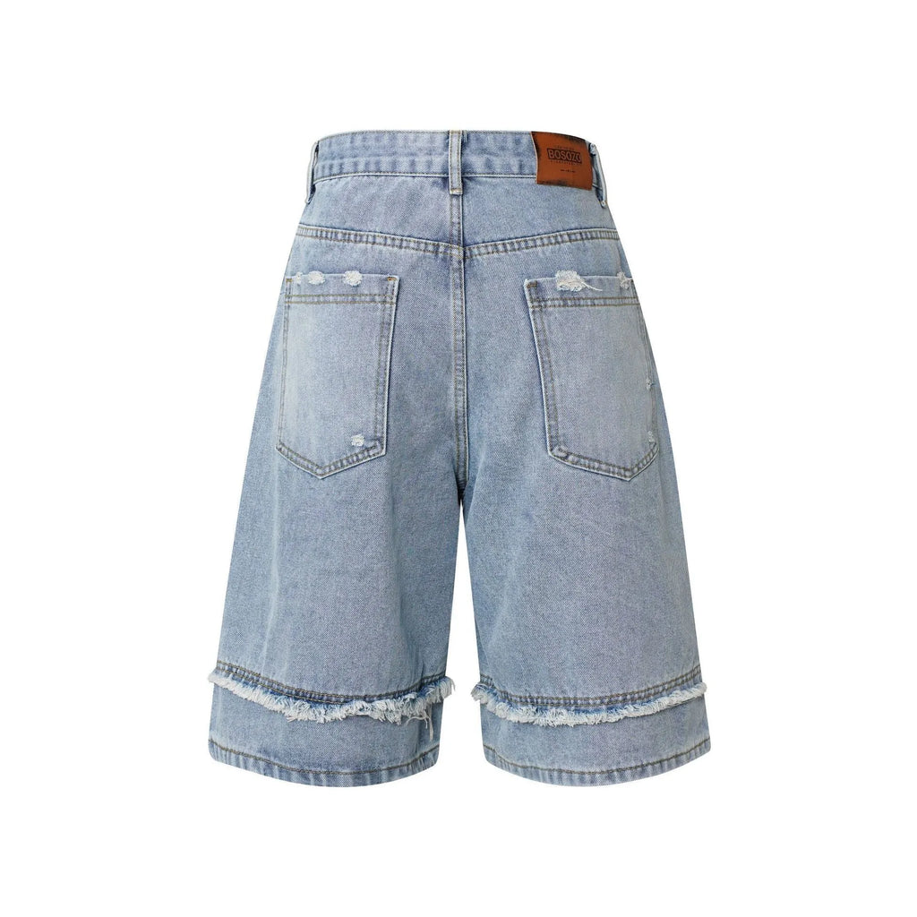 Distressed denim shorts with raw edge detailing in black, dark blue and light blue colours