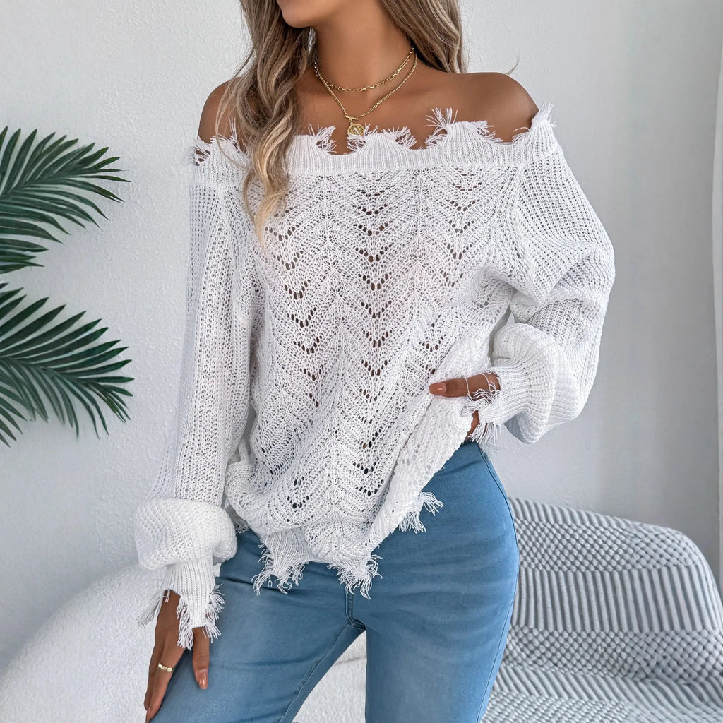 Women's white hollow-out off-the-shoulder long sleeve pullover sweater on a hanger.