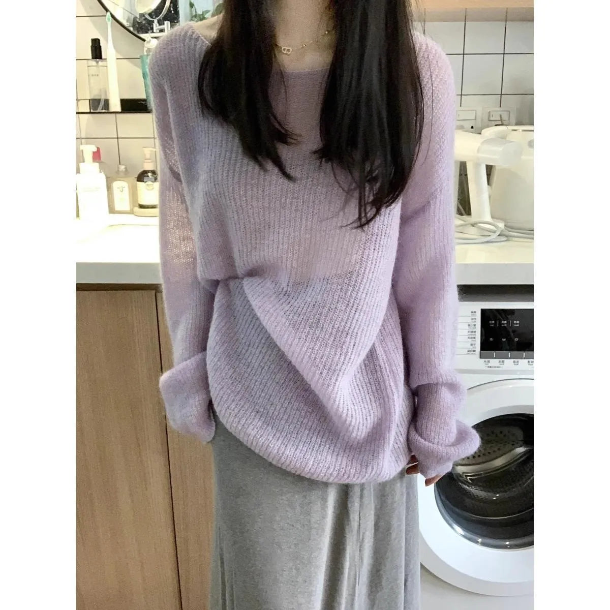 Purple ice silk women's blouse with hollow-out design and princess sleeves on a hanger.
