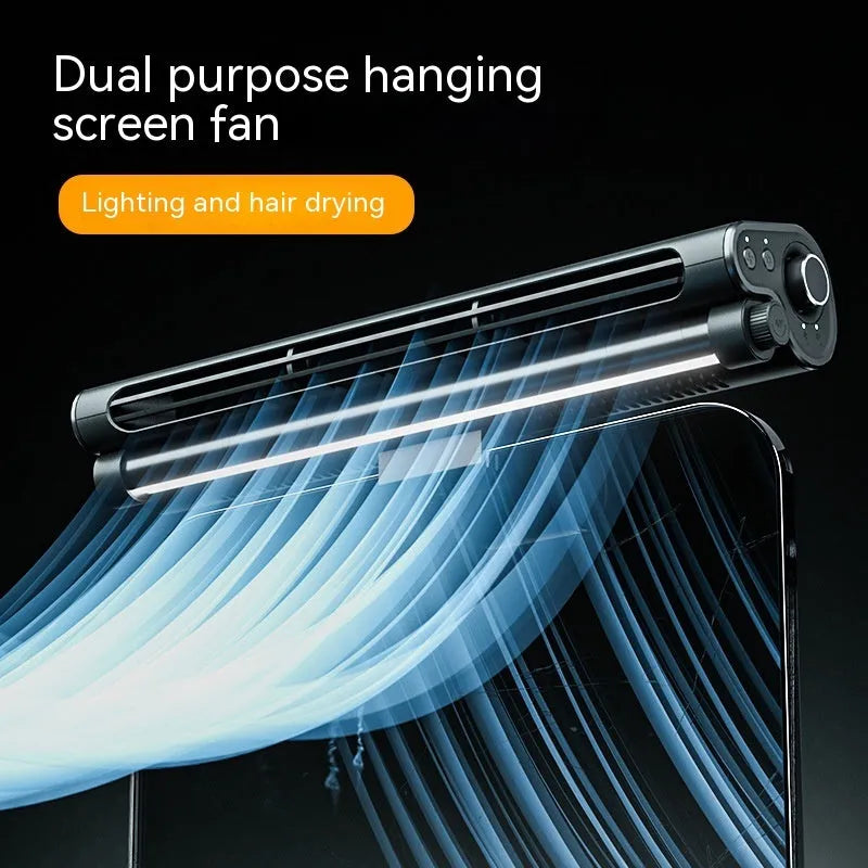 Black bladeless USB fan with clip attached to a laptop screen, showing integrated LED light.