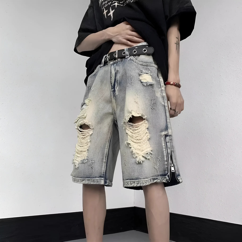 Blue retro tattered denim shorts with a wide leg loose fit on a person
