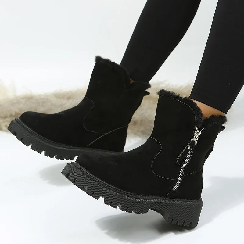 Women's black high-top faux suede snow boots with side zip and thick plush lining on a rubber sole.