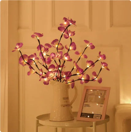 Pink LED phalaenopsis branch decorative light, 65 cm long, for indoor bedroom use.