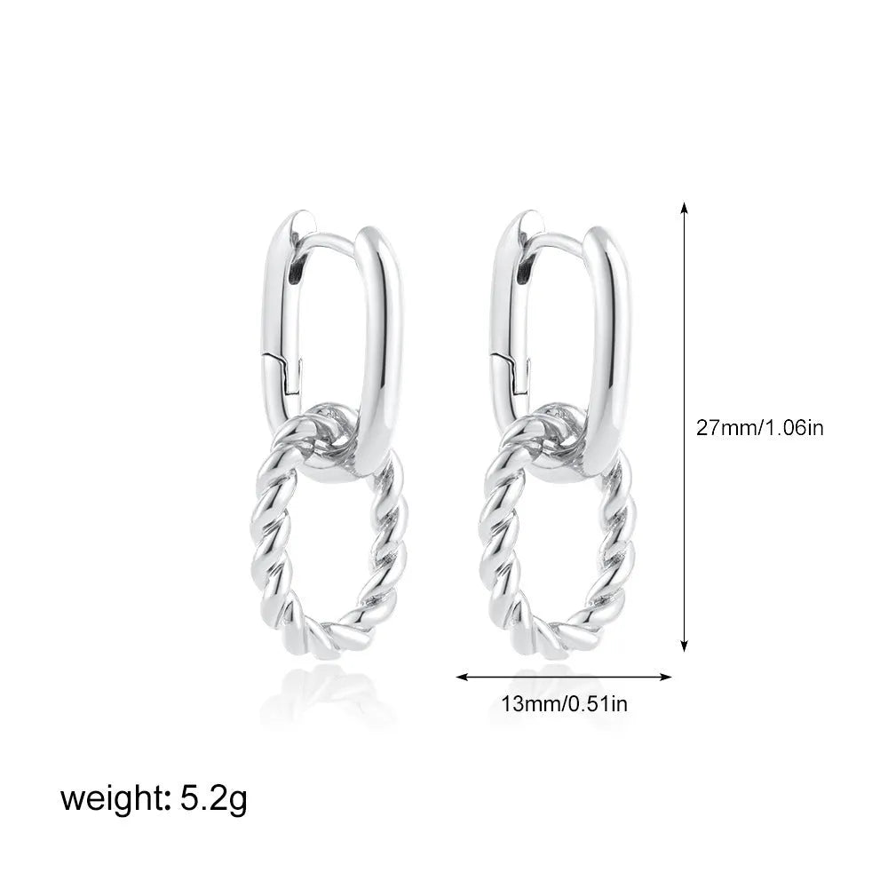 Double ring twist geometric square ear clip simple copper earrings on a neutral background